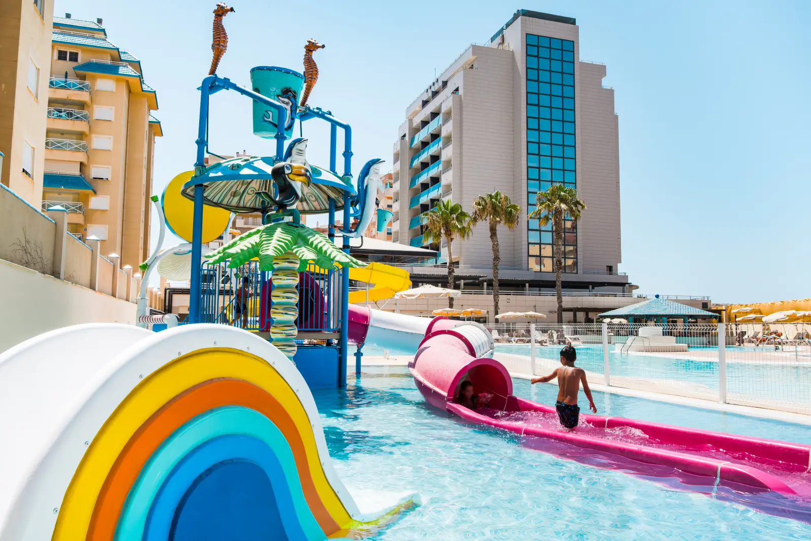 Splash area for children at the Bakour La Manga Splash water park with colourful mini slides and water games