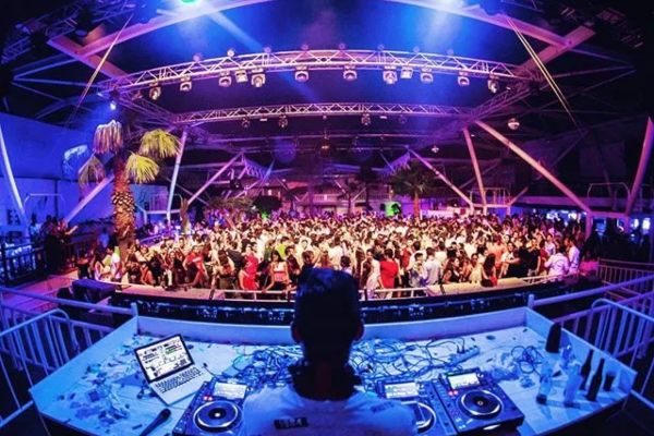 DJ booth and packed dance floor on a night at Trips Summer Club