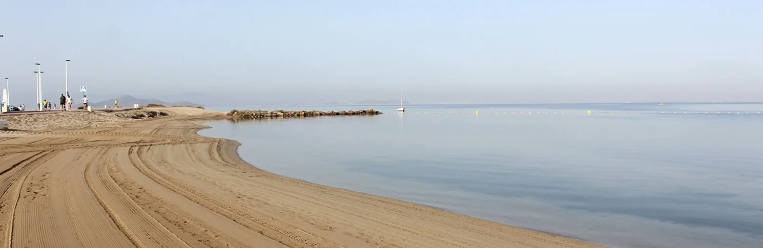 Shoreline and breakwater at Playa Mistral on the wave-free waters of Mar Menor