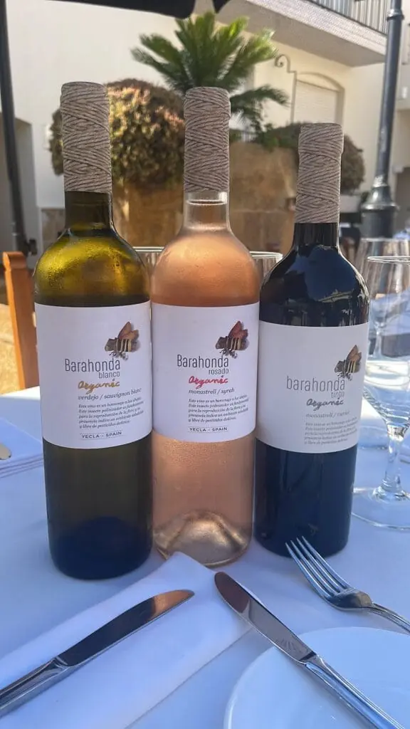 Bottles of wine served at a table at Abela Teresa, La Manga Club