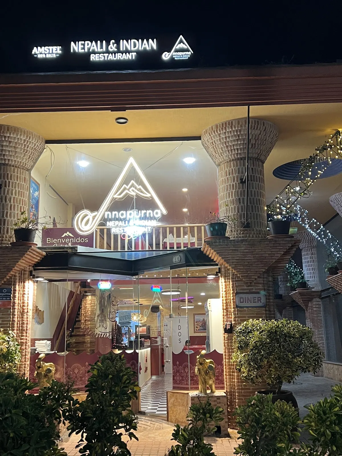 Illuminated entrance of Annapurna Nepali Restaurant in Los Belones