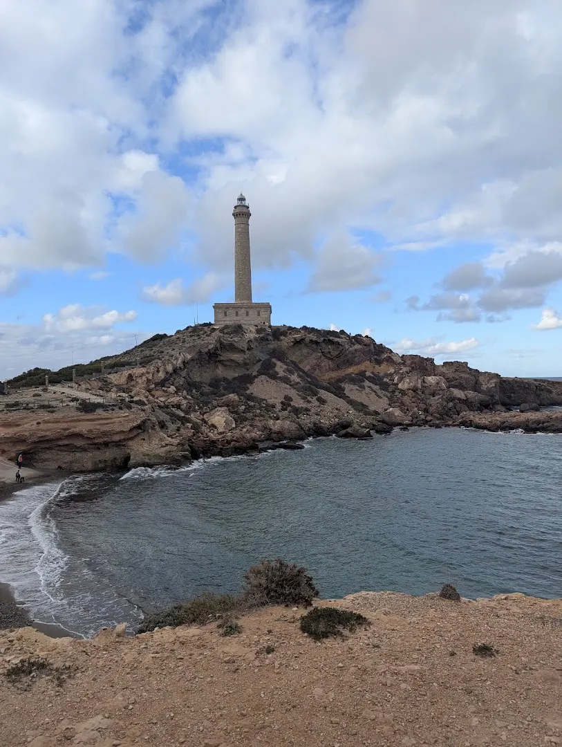 Faro de Cabo de Palos above a cove on the cape