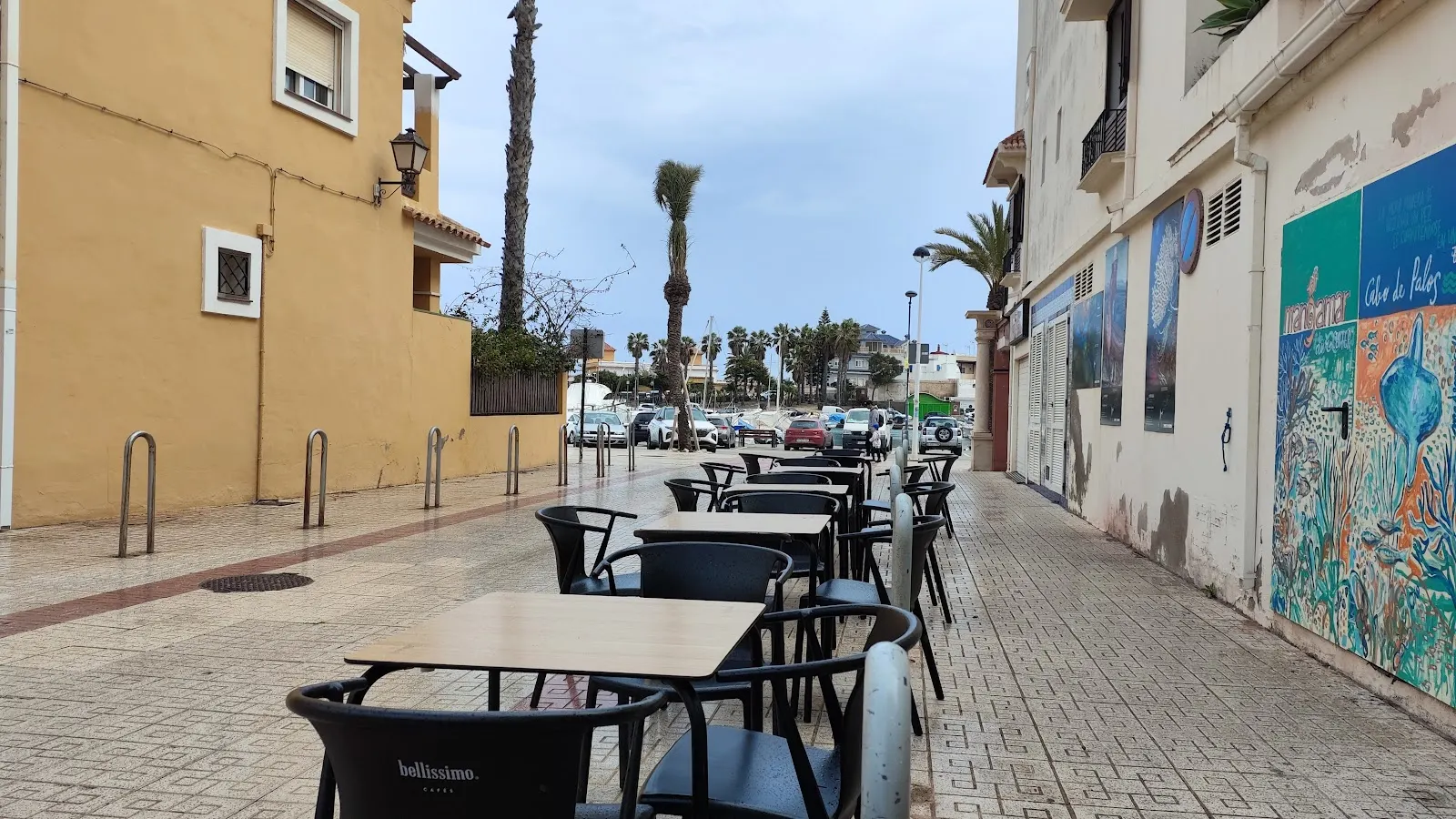 Terrace tables at 'Bellissimo' café on the promenade in Cabo de Palos, beside Café de Levante