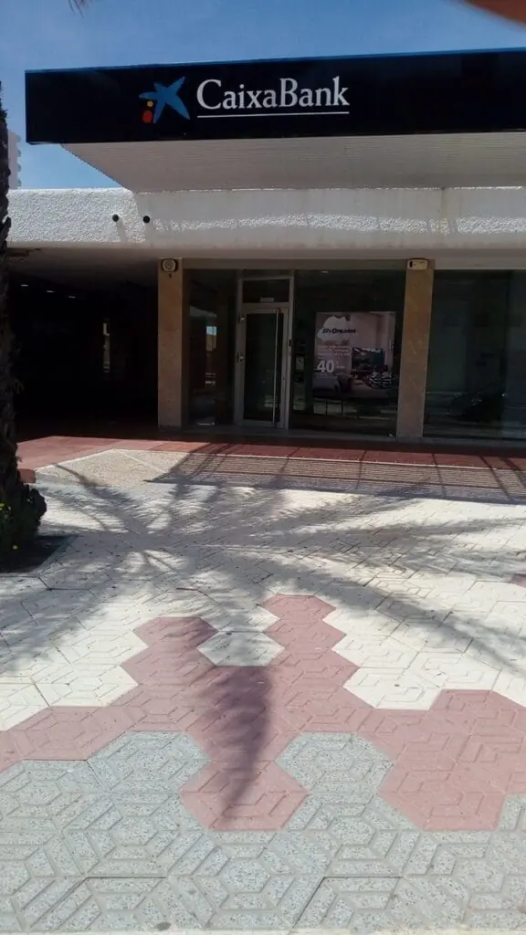 CaixaBank branch frontage with the sign at the entrance