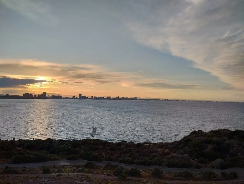 Sunset over the sea with La Manga in the background, from Cabo de Palos