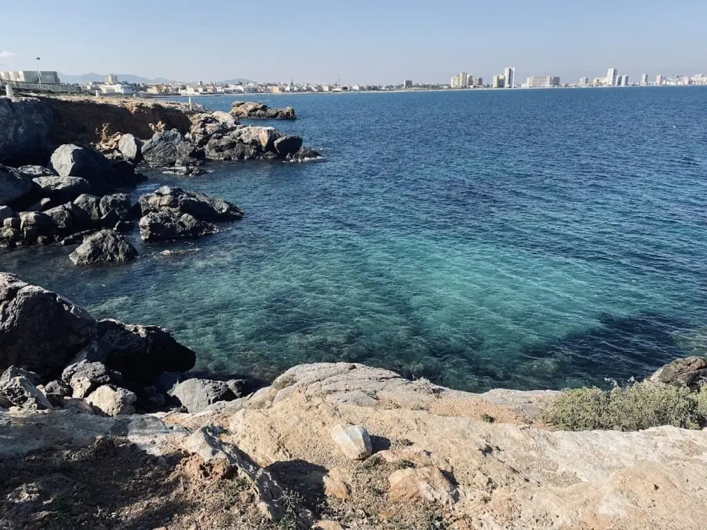 Rocky coast of Cabo de Palos with La Manga in the background