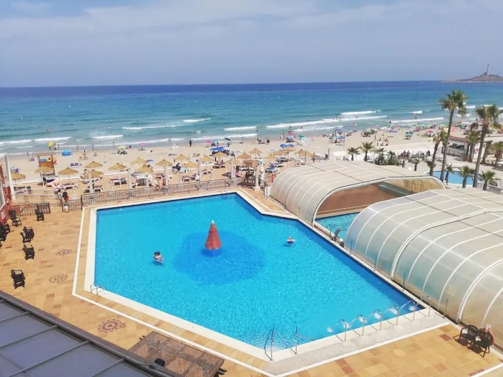 Outdoor pool at Hotel&Spa Entremares facing the beach