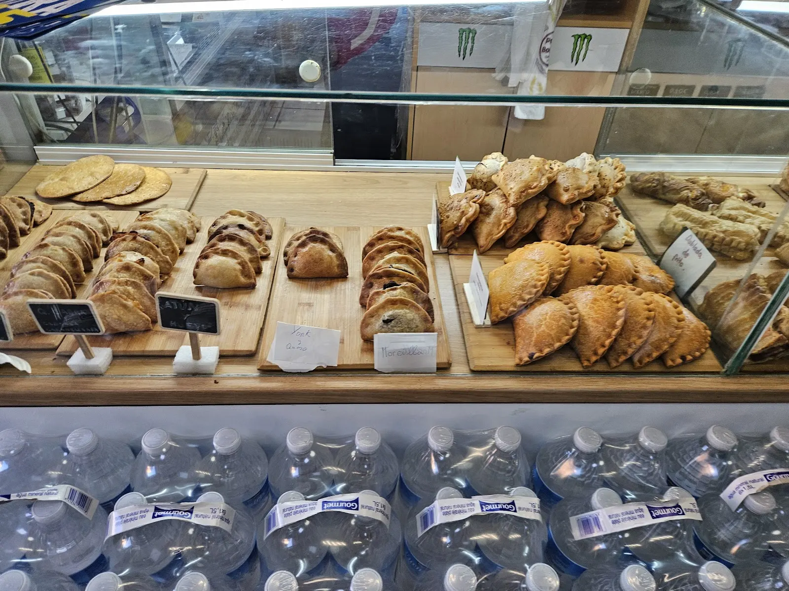 Display of empanadas (filled savoury pies) and biscuits at La Colegiala