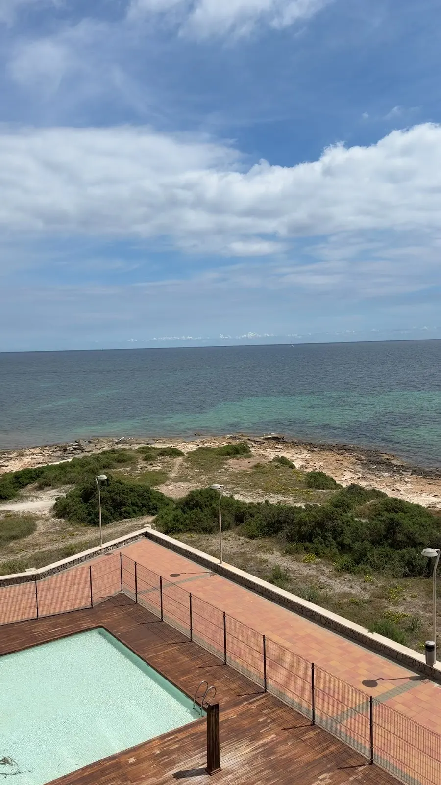 Sea views from the apartment terrace, overlooking the pool and dunes
