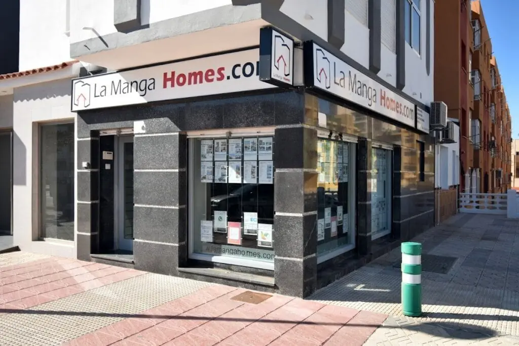 Exterior of the La Manga Homes office, with property adverts in the window