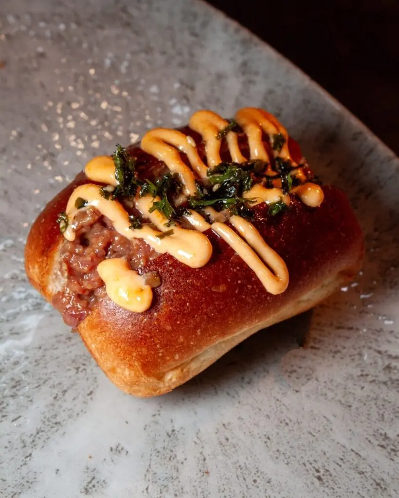 Filled baguette served at La Mestiza