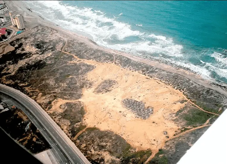 Aerial view of Las Amoladeras next to the road and the sea