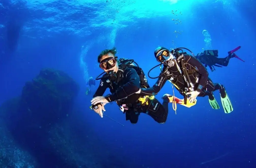 Mangamar Dive Center instructor and diver underwater in the Cabo de Palos Marine Reserve