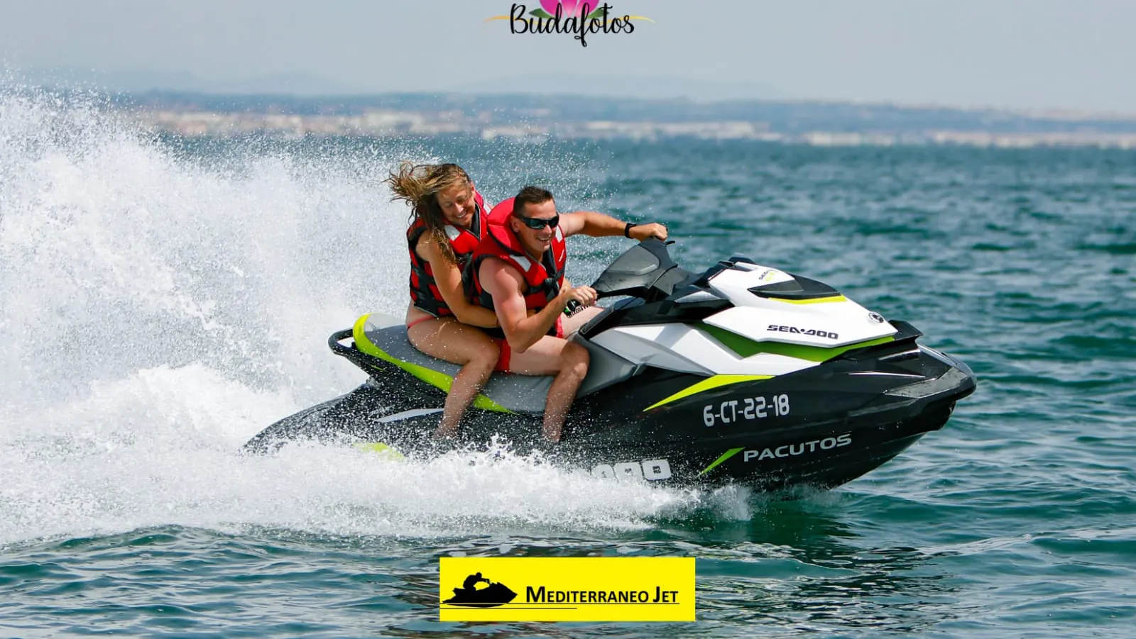 Two people speeding off on a jet ski with the Mediterráneo Jet logo