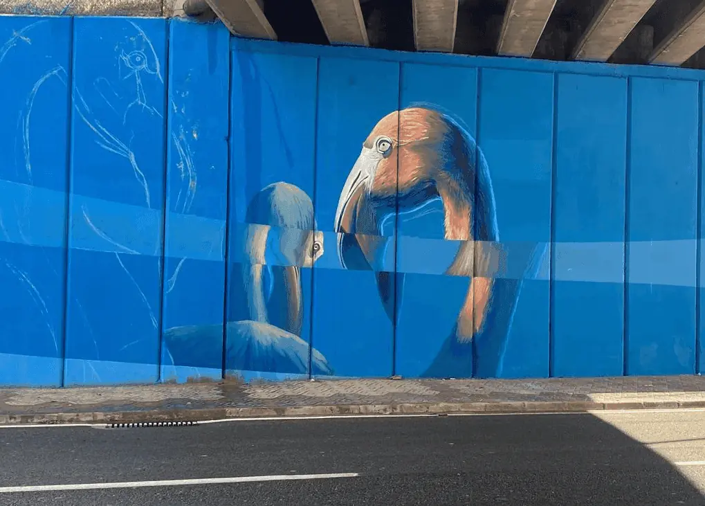 Flamingos painted under the bridge, on the Mural de Monteblanco