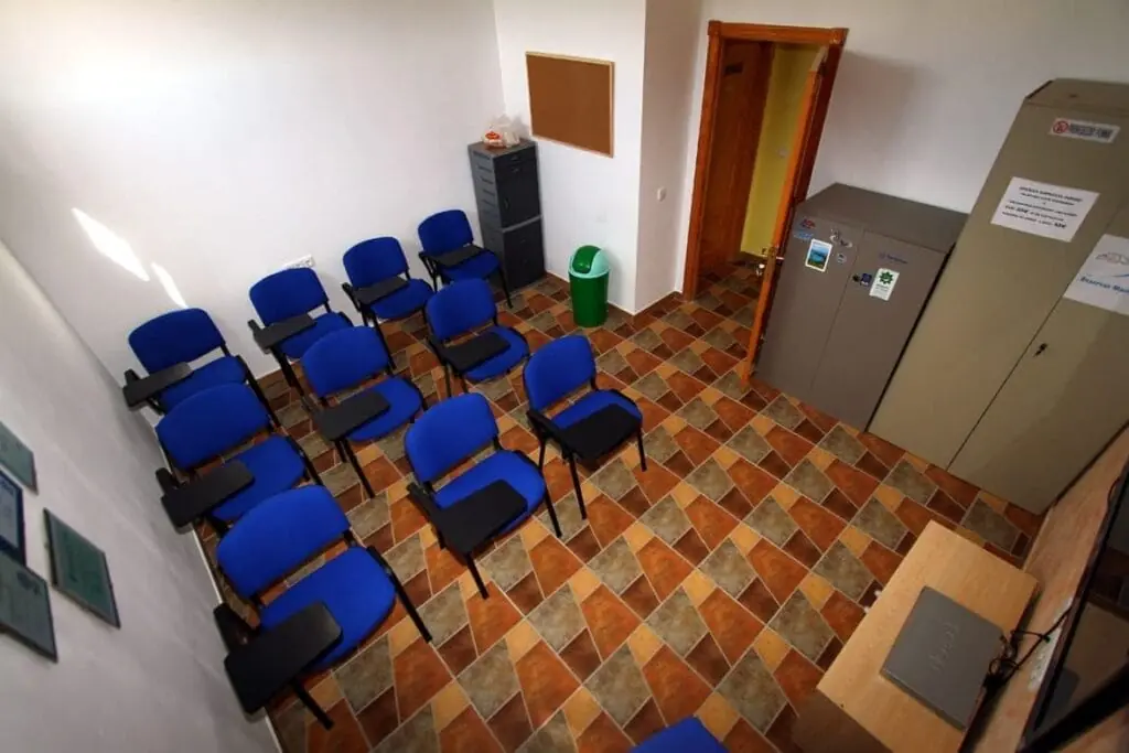 Training room at Naranjito dive centre, with chairs and lockers