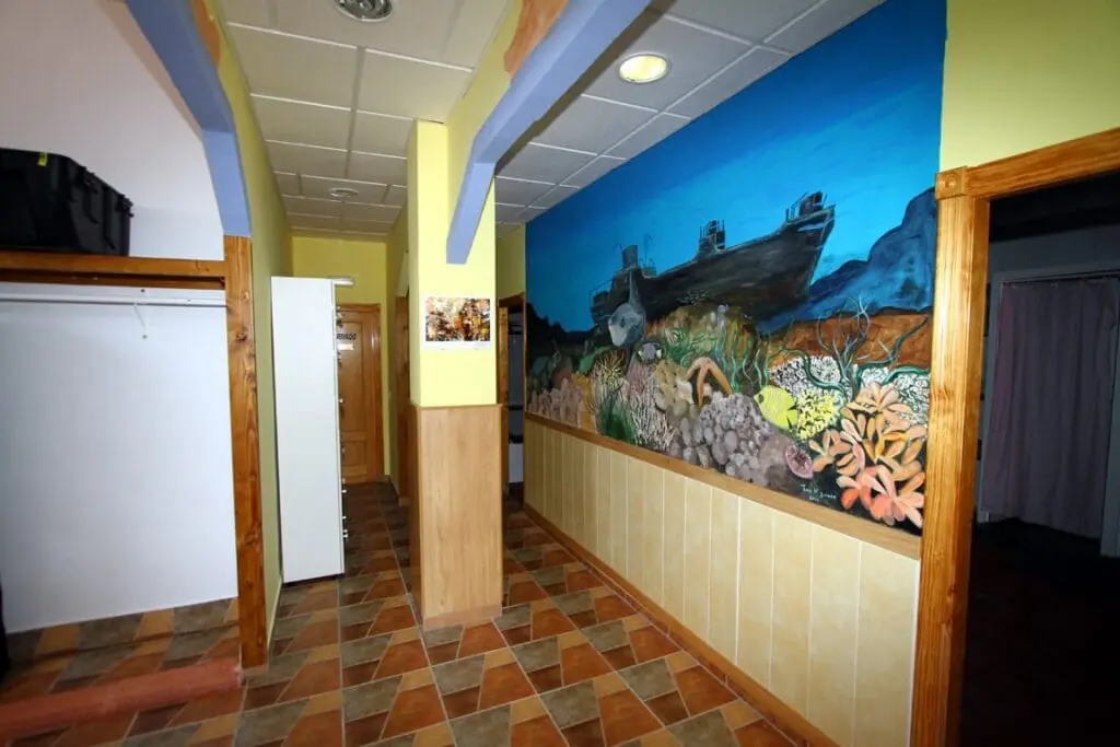 Underwater mural featuring a wreck in the corridor at Naranjito dive centre