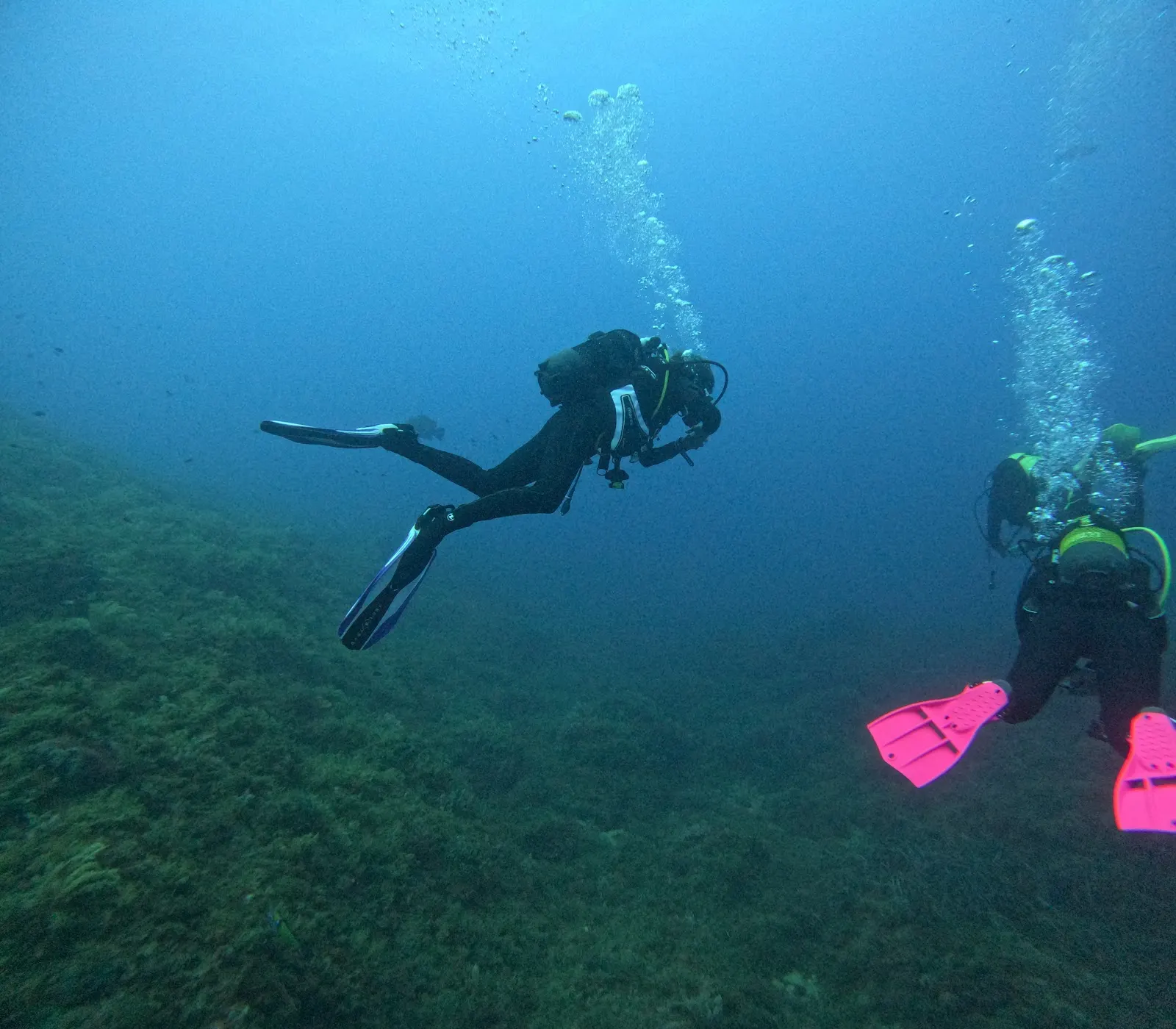 A Naranjito Buceo diver descending beside a buddy above the seabed off Cabo de Palos