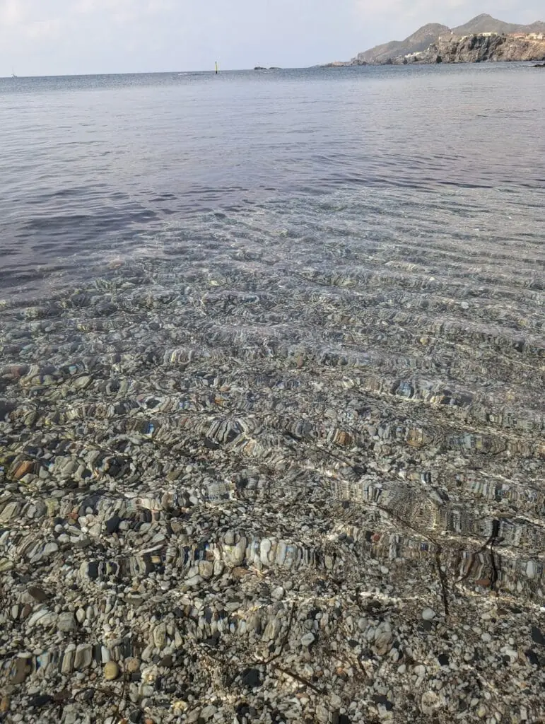 Clear water over a bed of pebbles