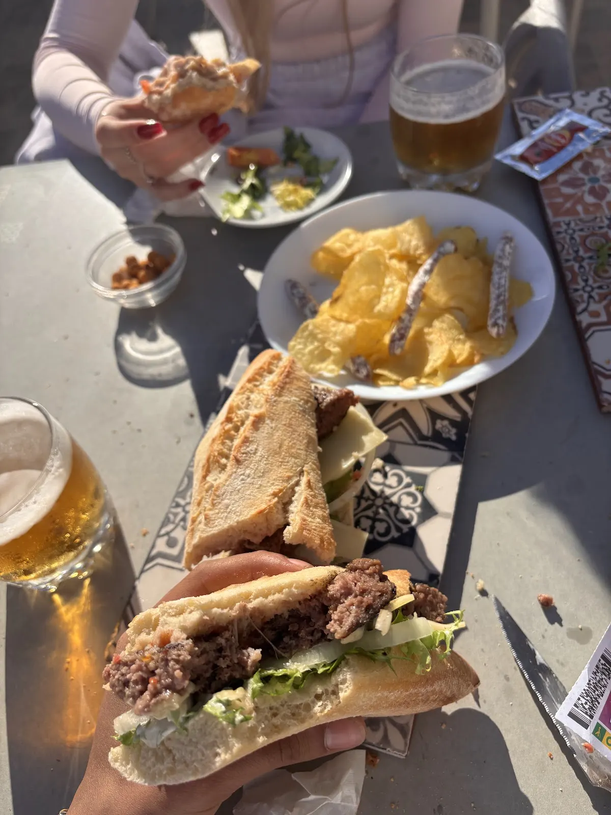 Filled baguettes and draught beers on the terrace at Punto de Amarre
