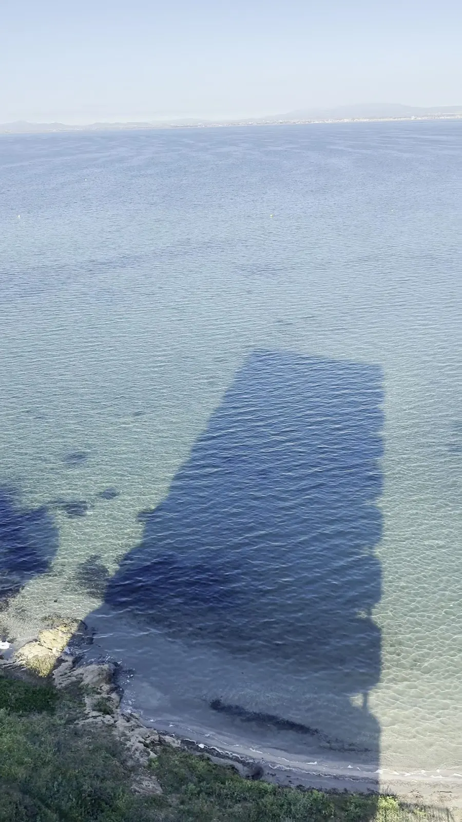 Aerial view of the rocky coast and clear waters of the Mar Menor beside La Manga